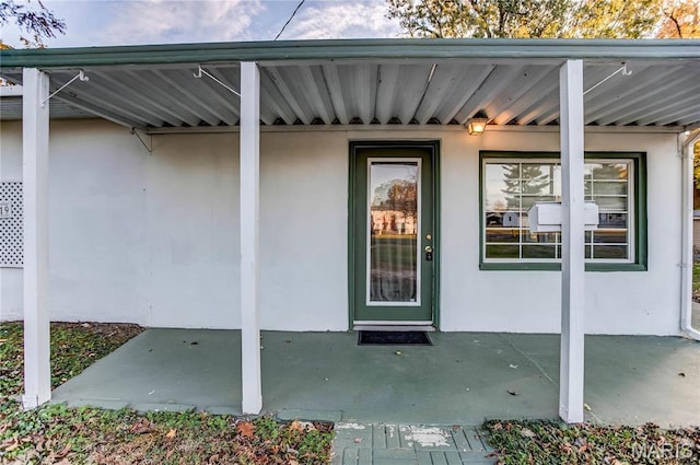 219 Highland St, Carrollton, IL 62016 - view of exterior entry featuring stucco siding