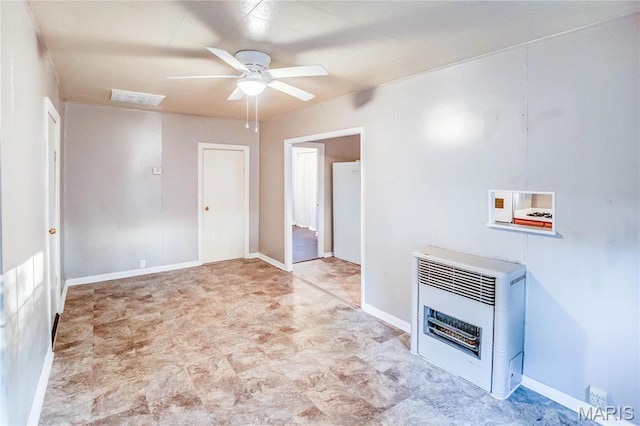 219 Highland St, Carrollton, IL 62016 - unfurnished living room featuring heating unit and ceiling fan