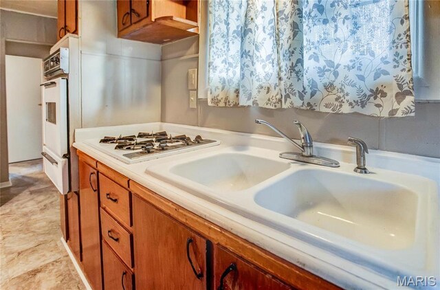 219 Highland St, Carrollton, IL 62016 - kitchen with white appliances, a sink, light countertops, and brown cabinetry