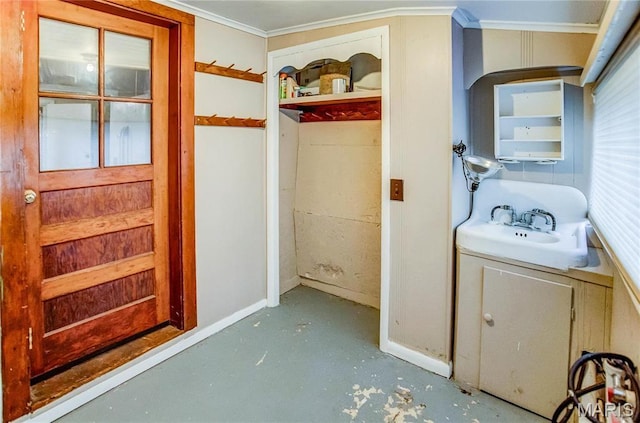219 Highland St, Carrollton, IL 62016 - bathroom featuring finished concrete floors, vanity, ornamental molding, and baseboards