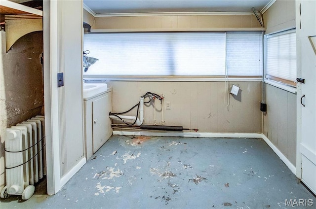 219 Highland St, Carrollton, IL 62016 - unfurnished sunroom with radiator heating unit and washer / clothes dryer