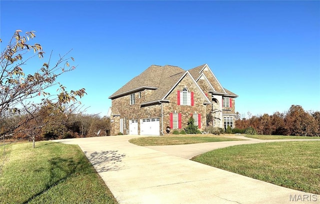 13185 Jenna Ln, Rolla, MO 65401 - traditional home with stone siding, an attached garage, driveway, and a front yard