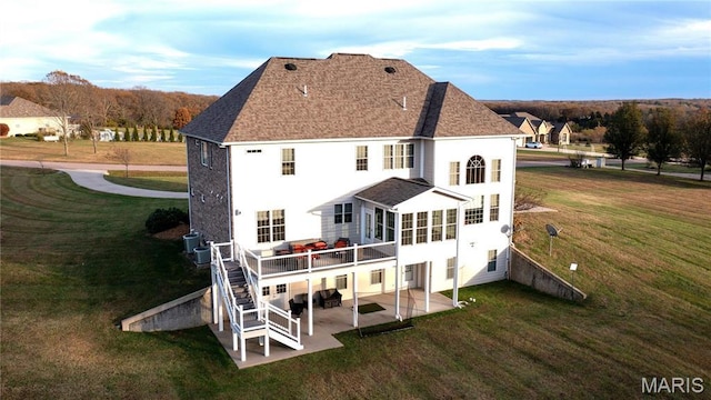 13185 Jenna Ln, Rolla, MO 65401 - rear view of property with a patio, a yard, and roof with shingles
