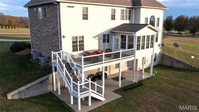 13185 Jenna Ln, Rolla, MO 65401 - rear view of property featuring a patio area, a yard, a deck, and roof with shingles