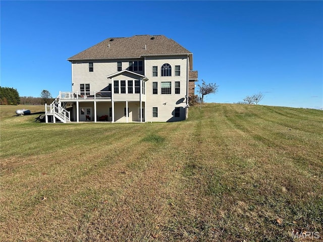 13185 Jenna Ln, Rolla, MO 65401 - back of house featuring a deck, a lawn, and stairs