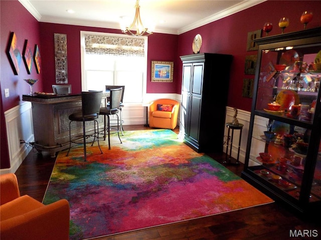 13185 Jenna Ln, Rolla, MO 65401 - bar area featuring ornamental molding, wainscoting, wood finished floors, and a chandelier