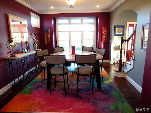 13185 Jenna Ln, Rolla, MO 65401 - dining area with crown molding, wood finished floors, baseboards, stairway, and recessed lighting