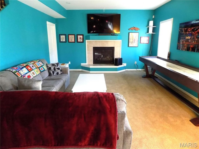 13185 Jenna Ln, Rolla, MO 65401 - carpeted living area featuring a fireplace and baseboards
