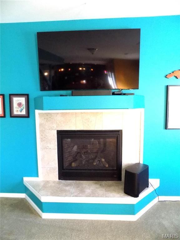 13185 Jenna Ln, Rolla, MO 65401 - detailed view of a tile fireplace, baseboards, and carpet