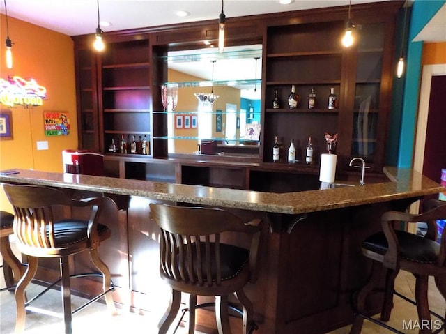 13185 Jenna Ln, Rolla, MO 65401 - indoor wet bar featuring hanging light fixtures and tile patterned floors