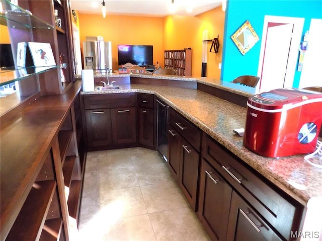 13185 Jenna Ln, Rolla, MO 65401 - bar featuring a sink, stainless steel refrigerator with ice dispenser, and light tile patterned flooring