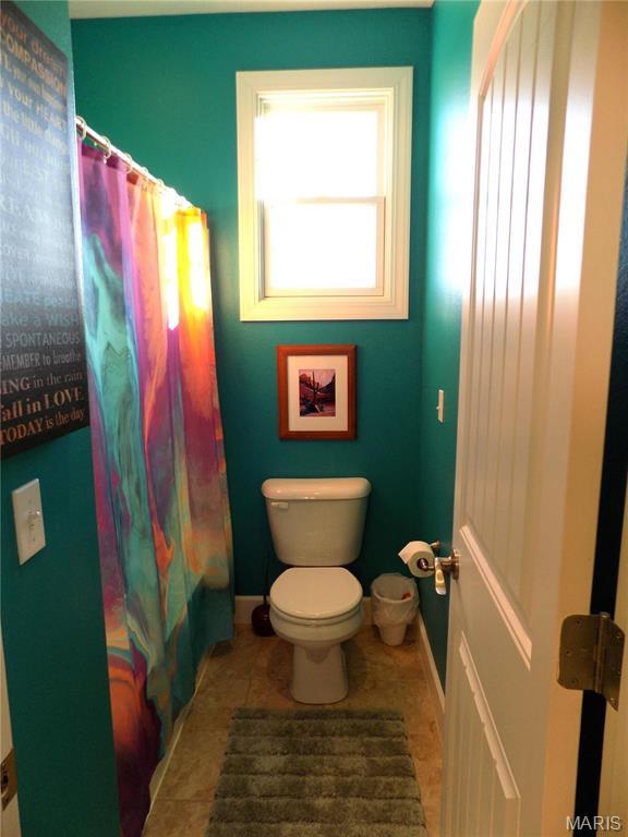 13185 Jenna Ln, Rolla, MO 65401 - bathroom featuring toilet, baseboards, and tile patterned floors