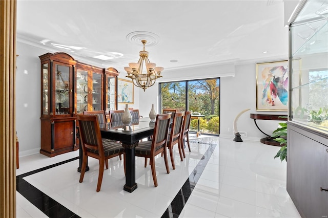 dining room featuring a chandelier, inlaid floor details, crown molding, light tile patterned floors, and baseboards