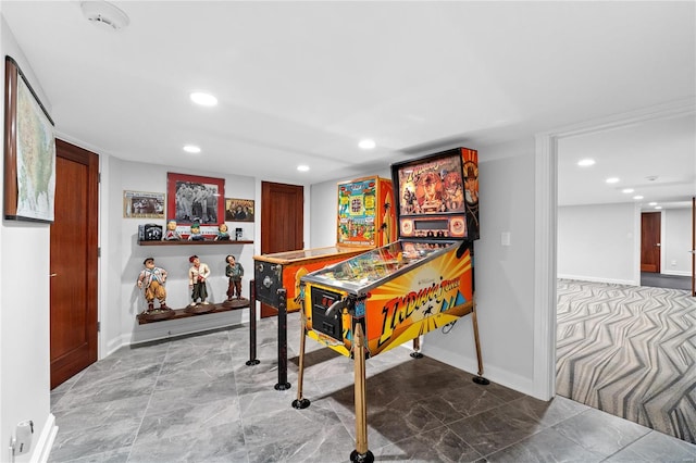 game room featuring baseboards, recessed lighting, and marble finish floors