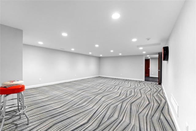 below grade area featuring carpet, recessed lighting, and baseboards