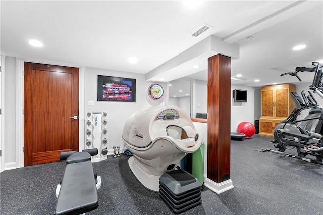 exercise area with recessed lighting and baseboards