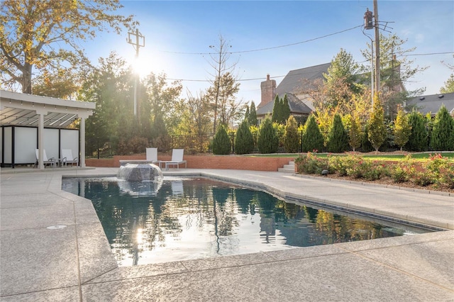 swimming pool featuring a patio and fence