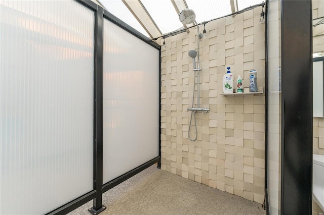 full bath with a tile shower