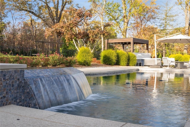 outdoor pool featuring fence