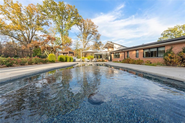 outdoor pool with a patio