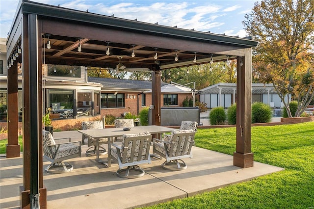 view of patio with outdoor dining space and a gazebo