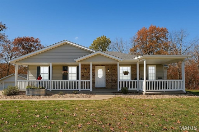 62812 Brown Ests, Hannibal, MO 63401 - ranch-style house featuring covered porch, brick siding, and a front lawn