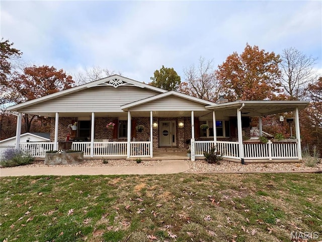 62812 Brown Ests, Hannibal, MO 63401 - view of front of home featuring a porch, a front yard, and brick siding