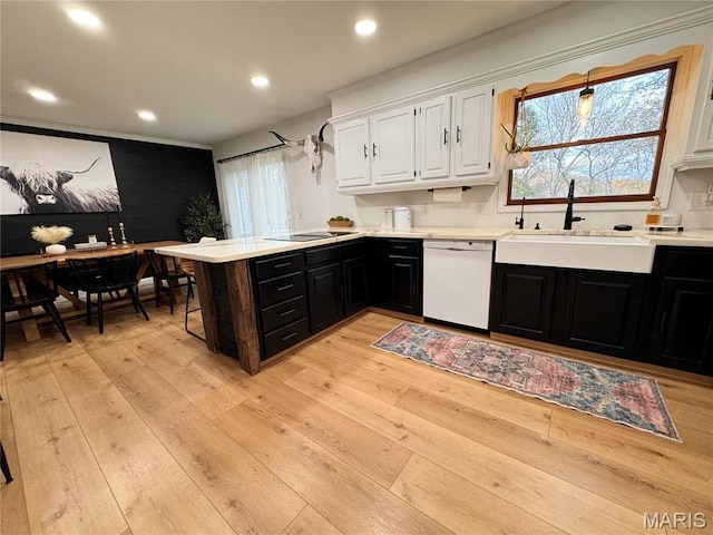 62812 Brown Ests, Hannibal, MO 63401 - kitchen with dishwasher, a sink, white cabinets, black electric stovetop, and light countertops