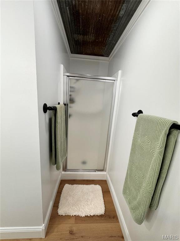 62812 Brown Ests, Hannibal, MO 63401 - full bath with ornamental molding, a shower stall, wood finished floors, and baseboards