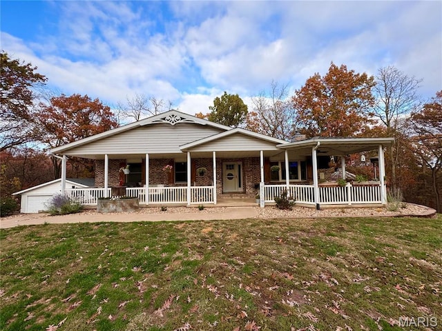62812 Brown Ests, Hannibal, MO 63401 - view of front of home featuring covered porch, a front lawn, and brick siding