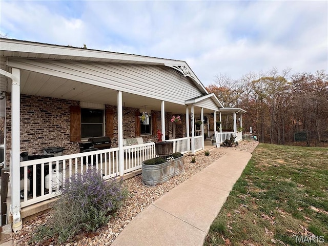 62812 Brown Ests, Hannibal, MO 63401 - view of front of property featuring a porch and brick siding