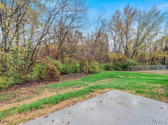 60 Cedar Brook Dr, Pacific, MO 63069 - view of yard featuring a patio and a wooded view