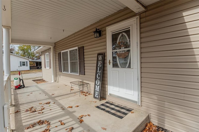 view of exterior entry featuring a porch