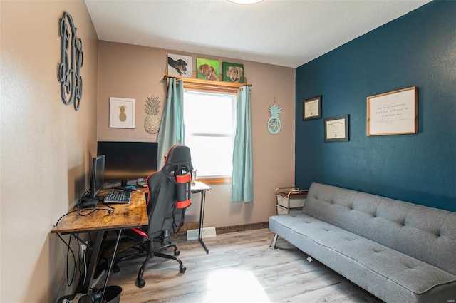 office featuring wood finished floors and baseboards