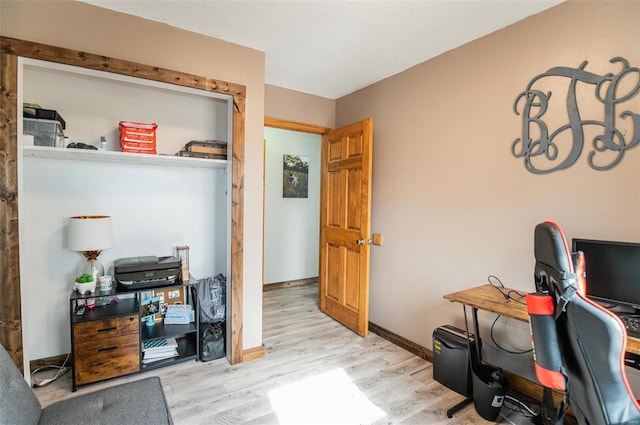 office area featuring wood finished floors and baseboards