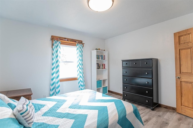 bedroom with light wood-style flooring