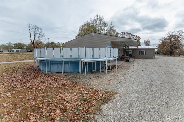 1106 W Parkview Dr, Belle, MO 65013 - rear view of property featuring an outdoor pool