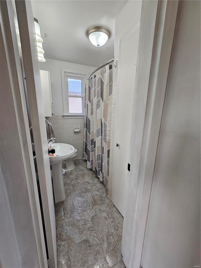 1324 Lebanon Ave, Belleville, IL 62221 - bathroom with tile walls and a shower with curtain