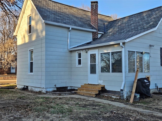 1324 Lebanon Ave, Belleville, IL 62221 - rear view of house with entry steps, roof with shingles, and a chimney