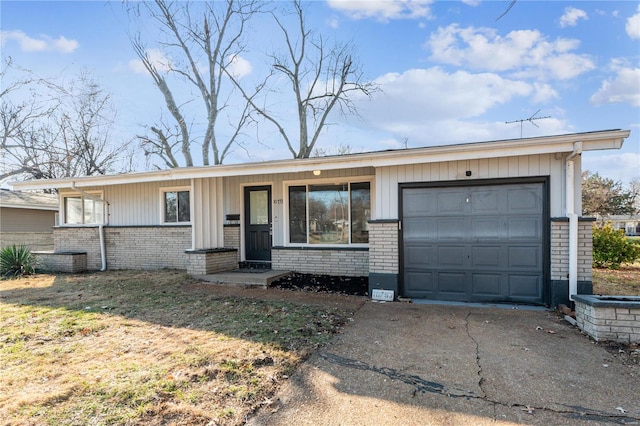 10753 Landseer Dr, Saint Louis, MO 63136 - single story home featuring brick siding, an attached garage, and driveway