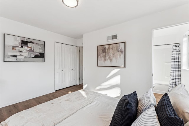 10753 Landseer Dr, Saint Louis, MO 63136 - bedroom featuring wood finished floors, ensuite bathroom, a closet, and baseboards