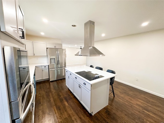 kitchen with stainless steel refrigerator with ice dispenser, black electric cooktop, island exhaust hood, a breakfast bar area, and dark wood-style floors