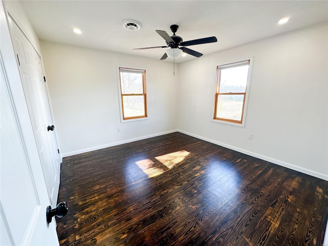 unfurnished room with dark wood finished floors, baseboards, a ceiling fan, and recessed lighting