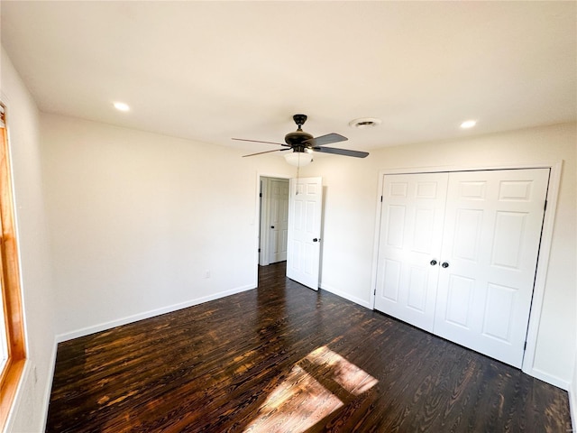 unfurnished bedroom with dark wood finished floors, baseboards, a closet, recessed lighting, and ceiling fan