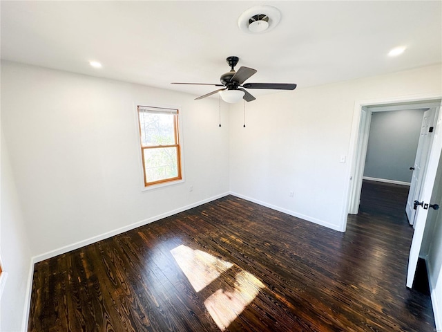 unfurnished room featuring dark wood-style floors, a ceiling fan, baseboards, and recessed lighting