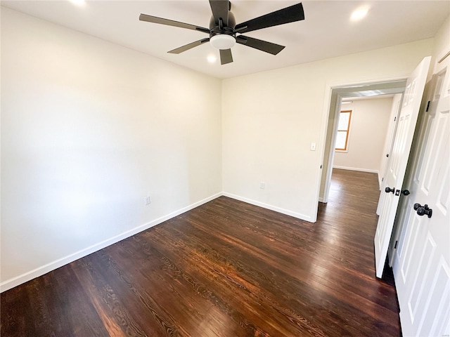 empty room featuring a ceiling fan, baseboards, dark wood-type flooring, and recessed lighting