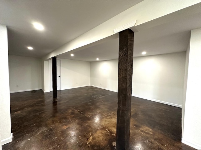 finished basement featuring recessed lighting and baseboards