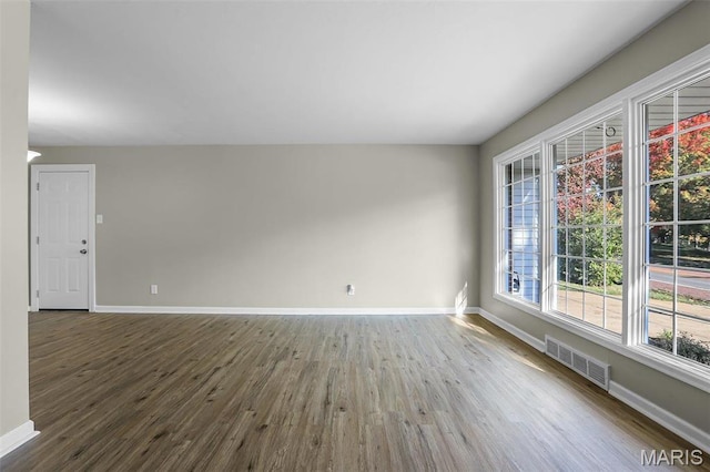 4000 Washington St, Florissant, MO 63033 - empty room with wood finished floors and baseboards