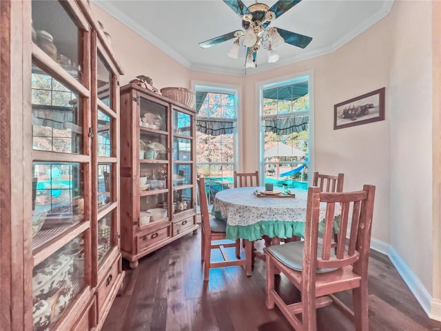 dining area featuring wood finished floors, ceiling fan, ornamental molding, and baseboards