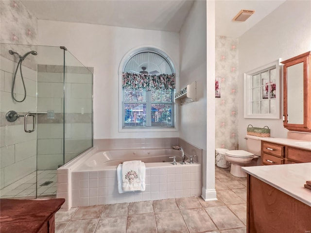 bathroom with vanity, a bath, tile patterned flooring, a shower stall, and toilet